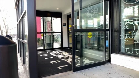 Automatic Door Opens To Cartoon Network’s New Hotel, the first of its kind Stock Footage 124008044