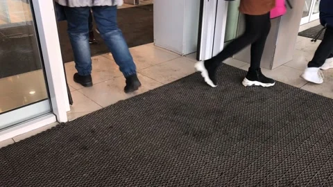 Automatic doors and legs Stock Footage 123330911