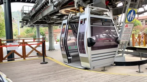 The automatic doors on the cable car open at the station. The cable car is Stock Footage 276747561
