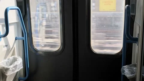 Automatic doors of the train the window at the running landscapes. Travel by Stock Footage 221523072