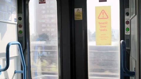 Automatic doors of the train the window at the running landscapes. Travel by Stock Footage 221873801