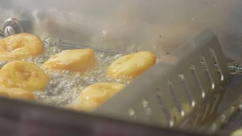 Automatic doughnut machine frying ring donuts Stock Footage 302475210