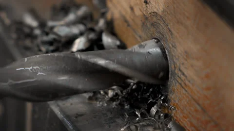 The Automatic Drill Bit Is piercing a hole in a Wooden Plank at Manufacturing Stock Footage 276321450