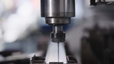 Automatic drilling machine with CNC control. The process of creating holes in a Stock Footage 243492828