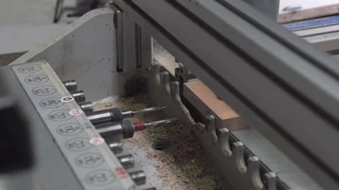 Automatic drilling machine makes a hole in a parts from chipboard. Stock-Footage 145991603