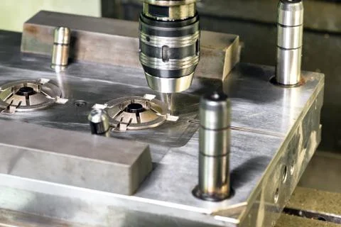 Automatic drilling machine over mold Stock Photos