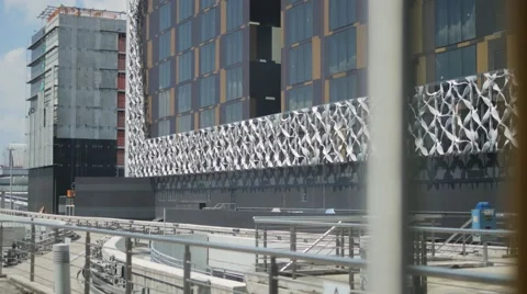 An automatic electric skytrain departing from the station platform in airport Stock Footage 65886788