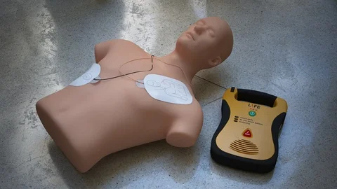 "An automatic electronic defibrillator. which can save live using electric Stock Footage 94585810