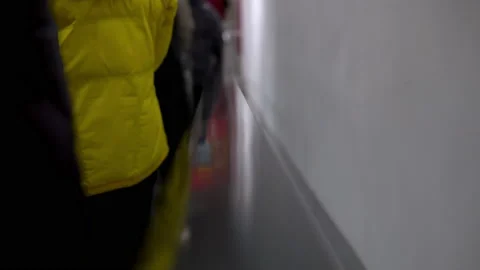 Automatic escalator in a mall, a crowd of people coming down Stock Footage 145003659