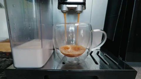 Automatic Espresso Machine Pouring Hot Coffee Into Double Wall Glass Cup Stock Footage 339179530