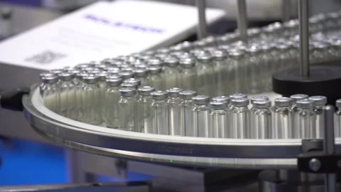 Automatic filling and sealing machine for glass ampoules 库存影片 99086392