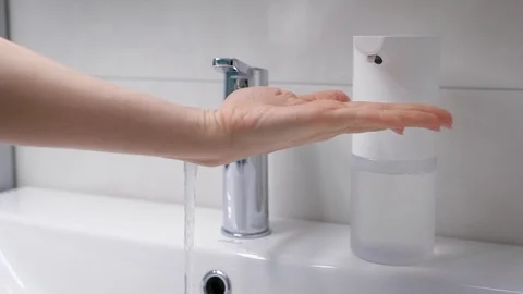 Automatic foam generator puts on hand the desired dose of soap. Modern Stock Footage 128749385