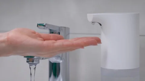 Automatic foam generator puts on hand the desired dose of soap. Modern Stock Footage 129005322