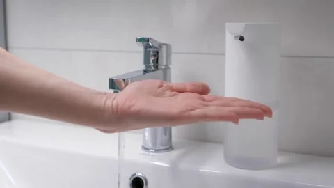 Automatic foam generator puts on hand the desired dose of soap. Modern Stock Footage 130956379