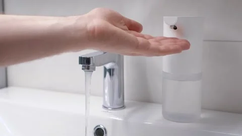 Automatic foam generator puts on hand the desired dose of soap. Modern Stock Footage 130956812