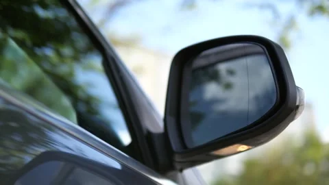Automatic folding and blinking car mirror against the sky. Stock Footage 312005859