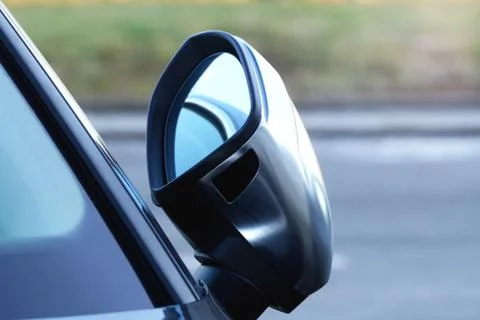Automatic folding rear view side mirror of a modern car. Rearview mirror of a Stock Photos