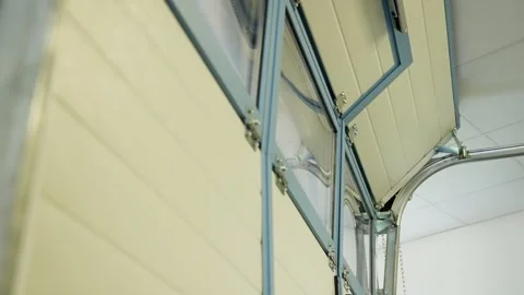 Automatic garage door opens smoothly using smart home Stock Footage 313535318