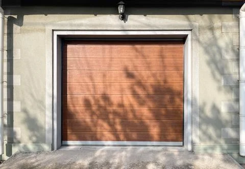 Automatic garage roller door in brown color Stock Photos