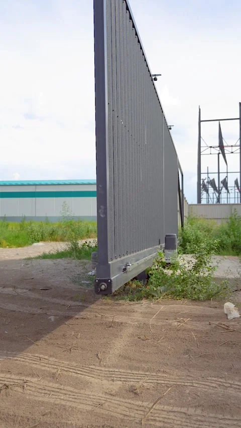 Automatic gate opener system with with electric motor gear rack rail and stop se Stock Footage 338300919