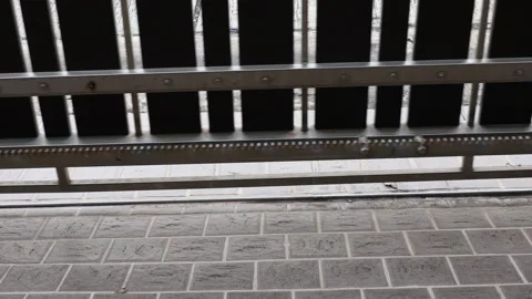 Automatic gate rolling on door track Stock Footage 322900020