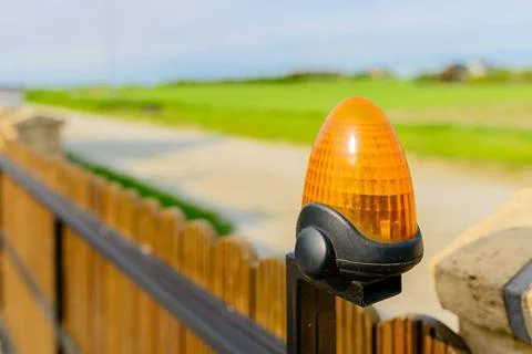  Automatic gate - wooden gate with warning lamp detail Automatic gate - wo... 스톡 사진