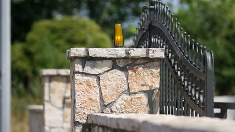 Automatic gates. Metal forged gates slowly close. Iron openwork gate at entrance Stock Footage 200926668