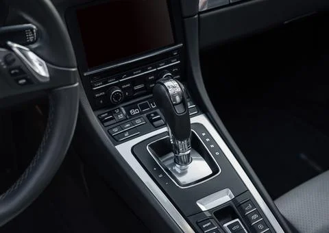 Automatic gear parked inside modern vehicle sports car automobile. Automatic Stock Photos