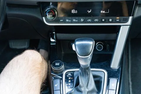 Automatic gear shift lever in modern car interior close up Stock Photos