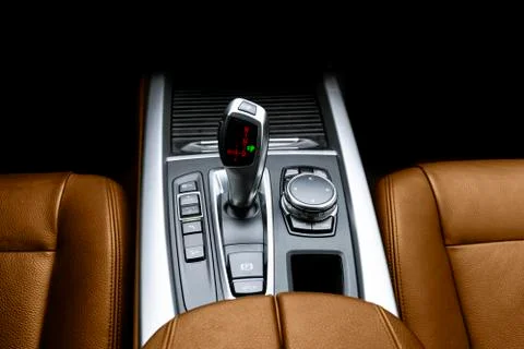 Automatic gear stick (transmission) of a modern car. Multimedia and navigatio Stock Photos