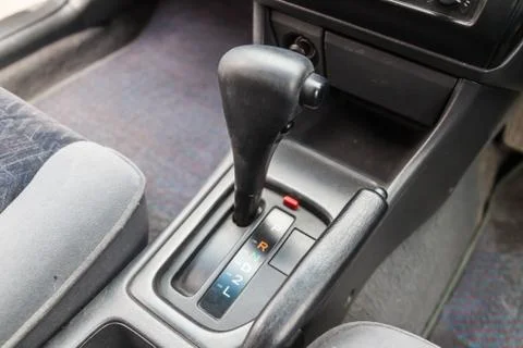 Automatic gearbox in the car on a gray background for movement and accelerati Stock Photos