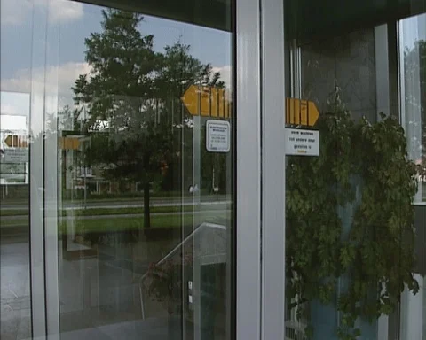 Automatic glass panel sliding door opens and closes - no people Stock Footage 123062765