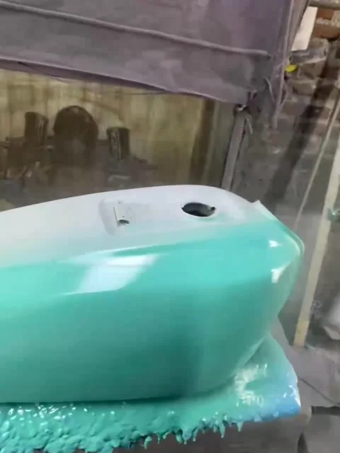 Automatic green motorcycle body repainting process Stock Footage 308510491