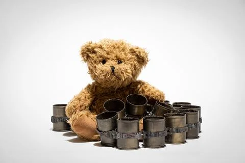 Automatic grenade launcher casing tape and teddy bear on a white background, Stock Photos
