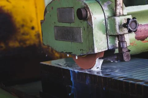 Automatic grinder machine active with cooling water Stock Photos