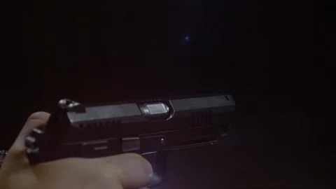 Automatic gun firing two bullets, Ultra Slow Motion Stock Footage