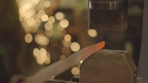 Automatic hammer hits the hot iron with sparks Stock Footage 154348946