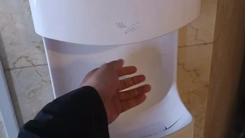 Automatic Hand Dryer Mounted on Wall in Modern Office Restroom Stock Footage 282758803