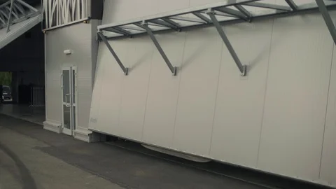 Automatic hangar door closing. View from outside Stock Footage 122084041