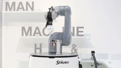 Automatic HelMo mobile robot on Staubli stand on Messe fair in Hannover, Germany Stock Footage 97789582