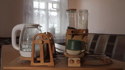 An automatic home-made tea machine prepares a cup of tea Vídeos de archivo 233606851