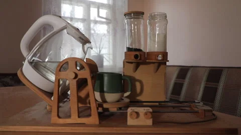 An automatic home-made tea machine prepares a cup of tea Video stock 233607058