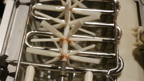 Automatic ice-making plant close-up. The empty bin is open. Plastic agitator rot Stock Footage 129896307