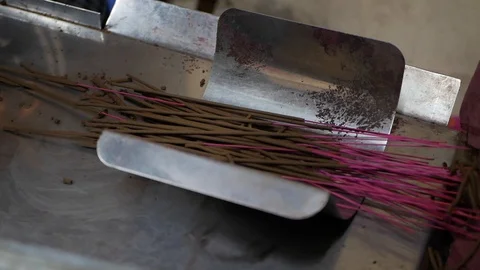 Automatic incense stick making machine. Vietnamese woman working in the old Stock-Footage 125287800