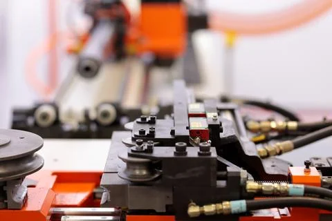 Automatic industrial pipe bending machine close up Stock Photos