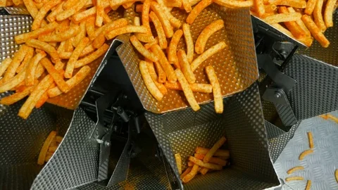 Automatic industrial scale distributes potato snacks to pack Stock Footage 74146561