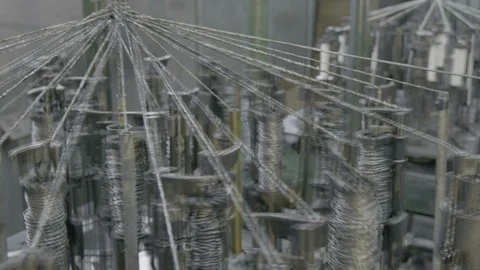 Automatic industrial sewing machine for knitting a braid of non-combustible Stock Footage 126330738