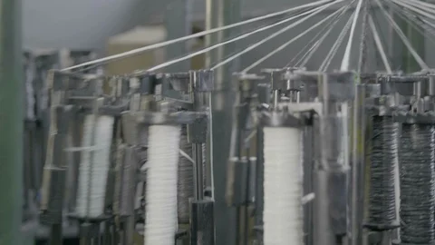 Automatic industrial sewing machine for knitting a braid of non-combustible Stock Footage 126409964