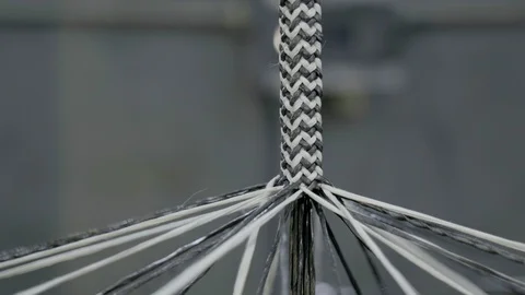 Automatic industrial sewing machine for knitting a braid of non-combustible Stock Footage 126526645