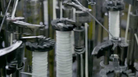 Automatic industrial sewing machine for knitting a braid of non-combustible Stock Footage 127251520